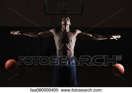 Barechested basketball player dribbling two basketballs View Large Photo Image Stock Photography - Barechested basketball player dribbling two basketballs. Fotosearch