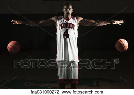 Basketball player dribbling two balls View Large Photo Image Stock Image - Basketball player dribbling two balls. Fotosearch