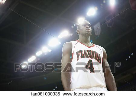 Basketball player, low angle view View Large Photo Image Stock Photography - Basketball player, low angle view. Fotosearch