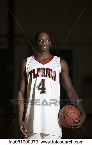 Stock Image - Basketball player, portrait. Fotosearch