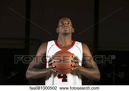 Basketball player preparing to shoot basketball, portrait View Large Photo Image Stock Image - Basketball player preparing to shoot basketball, portrait. Fotosearch
