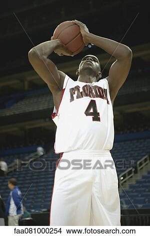 Basketball player shooting basketball View Large Photo Image Picture - Basketball player shooting basketball. Fotosearch