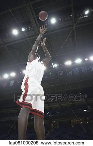Basketball player shooting basketball View Large Photo Image Stock Photo - Basketball player shooting basketball. Fotosearch