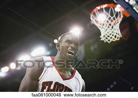 Basketball player shouting View Large Photo Image Stock Photo - Basketball player shouting. Fotosearch