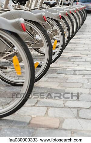 Bicycles parked in a row, cropped View Large Photo Image Stock Image - Bicycles parked in a row, cropped. Fotosearch