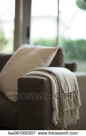 Blanket and cushion on sofa, cropped View Large Photo Image Stock Photo - Blanket and cushion on sofa, cropped. Fotosearch