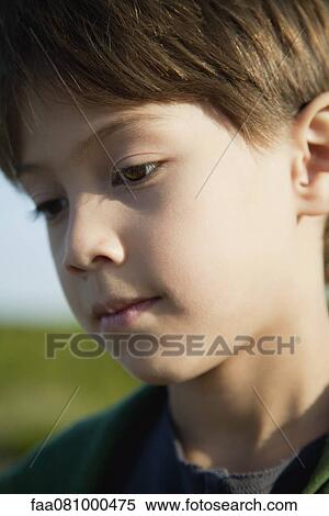 Stock Photography - Boy looking away, portrait. Fotosearch