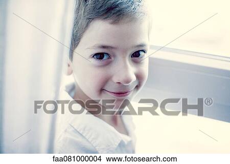 Picture - Boy smiling at camera, portrait. Fotosearch