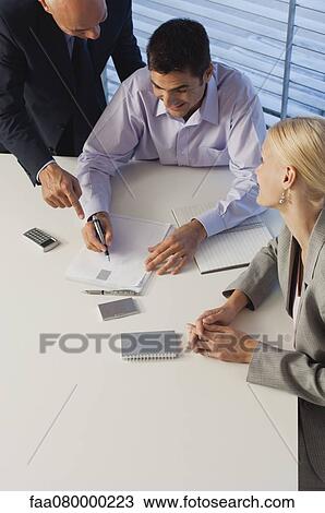 Business associates brainstorming together View Large Photo Image Stock Image - Business associates brainstorming together. Fotosearch