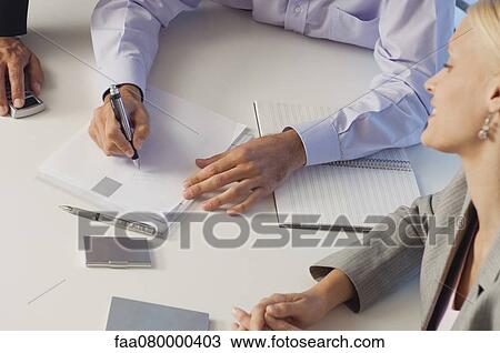 Business associates brainstorming together, cropped View Large Photo Image Stock Image - Business associates brainstorming together, cropped. Fotosearch