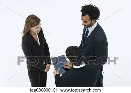 Business associates chatting while colleague uses digital tablet View Large Photo Image Stock Image - Business associates chatting while colleague uses digital tablet. Fotosearch