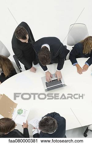 Business associates collaborating View Large Photo Image Stock Image - Business associates collaborating. Fotosearch
