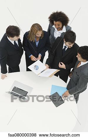 Business associates collaborating View Large Photo Image Stock Photo - Business associates collaborating. Fotosearch