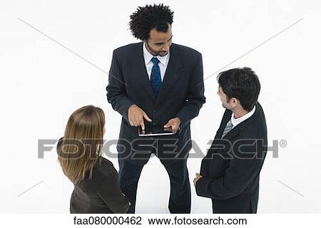 Business associates collaborating with digital tablet View Large Photo Image Stock Image - Business associates collaborating with digital tablet. Fotosearch