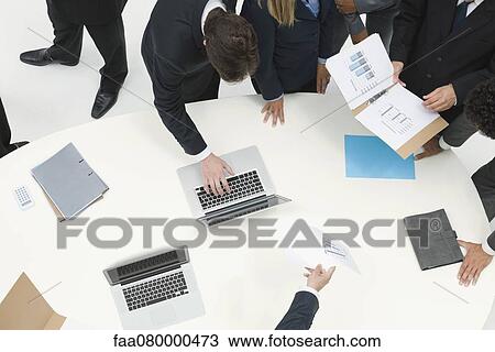 Business associates working together as team View Large Photo Image Stock Image - Business associates working together as team. Fotosearch