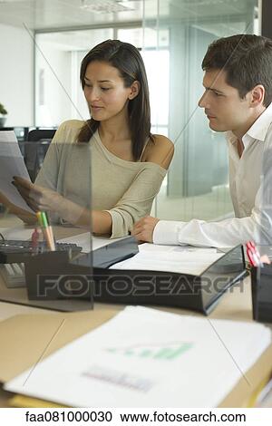 Business associates working together in office View Large Photo Image Stock Image - Business associates working together in office. Fotosearch