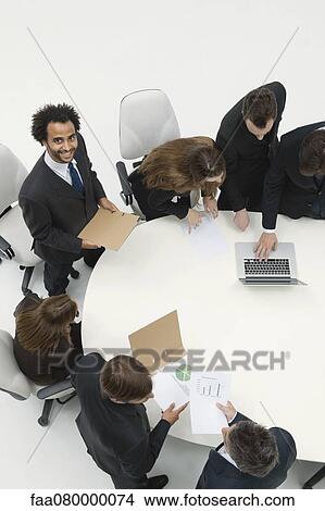 Businessman preparing presentation for business meeting View Large Photo Image Picture - Businessman preparing presentation for business meeting. Fotosearch
