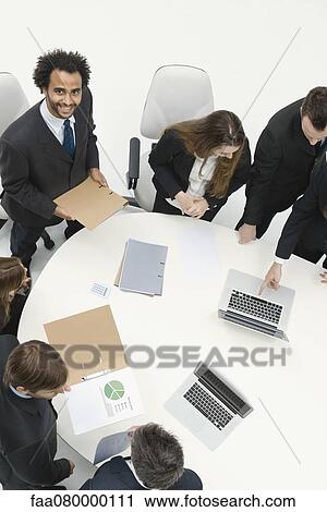 Businessman preparing presentation for business meeting View Large Photo Image Stock Image - Businessman preparing presentation for business meeting. Fotosearch