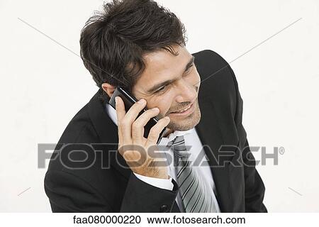 Businessman talking on cell phone View Large Photo Image Stock Image - Businessman talking on cell phone. Fotosearch