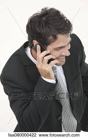 Businessman talking on cell phone, elevated view View Large Photo Image Stock Image - Businessman talking on cell phone, elevated view. Fotosearch