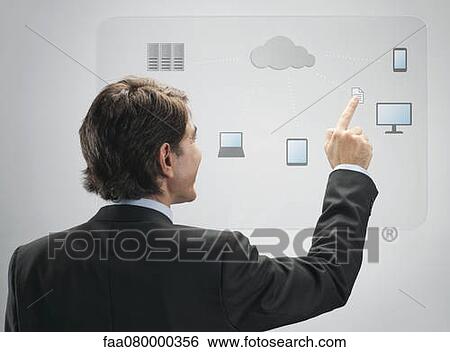 Businessman using cloud computing technology on advanced touch screen interface View Large Photo Image Stock Photograph - Businessman using cloud computing technology on advanced touch screen interface. Fotosearch