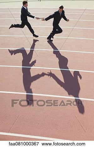 Stock Photo - Businessmen running relay race. Fotosearch