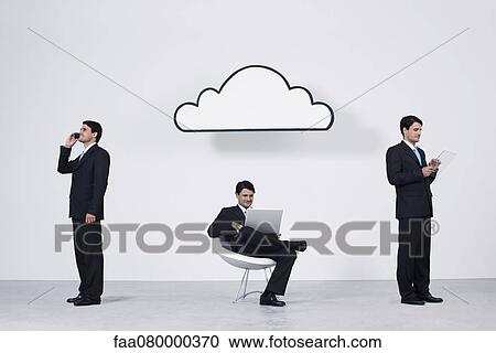 Businessmen using wireless devices with cloud computing network View Large Photo Image Stock Image - Businessmen using wireless devices with cloud computing network. Fotosearch