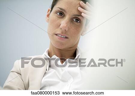Businesswoman holding head View Large Photo Image Stock Image - Businesswoman holding head. Fotosearch