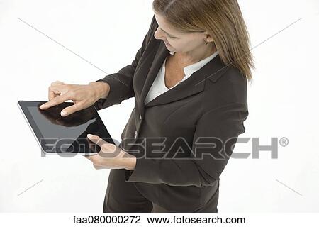 Businesswoman using digital tablet View Large Photo Image Stock Image - Businesswoman using digital tablet. Fotosearch