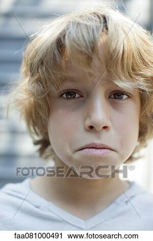 Stock Image - By frowning, portrait. Fotosearch