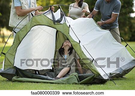 Campers setting up tent View Large Photo Image Stock Photo - Campers setting up tent. Fotosearch