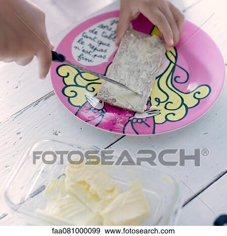 Child preparing snack, cropped View Large Photo Image Stock Photo - Child preparing snack, cropped. Fotosearch
