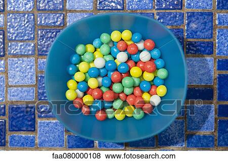Stock Photo - Colorful candies in bowl. Fotosearch