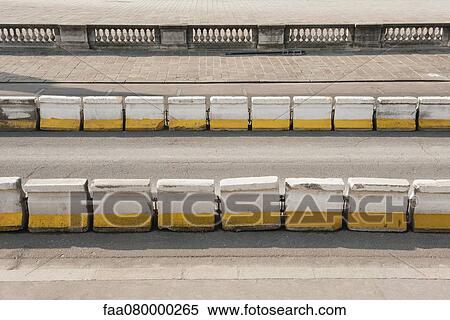 Concrete barriers lining street View Large Photo Image Stock Photography - Concrete barriers lining street. Fotosearch