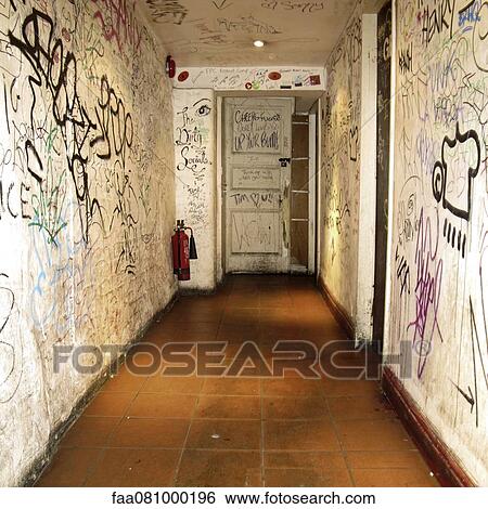 Stock Photograph - Corridor walls covered with graffiti. Fotosearch
