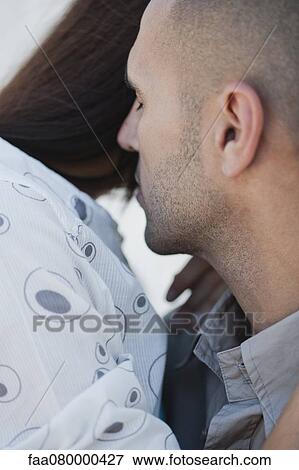 Couple embracing, cropped View Large Photo Image Stock Photo - Couple embracing, cropped. Fotosearch