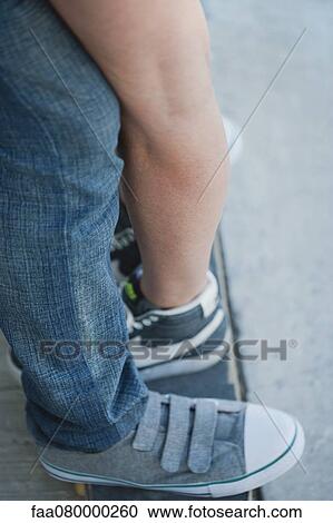 Couple embracing, low section View Large Photo Image Stock Image - Couple embracing, low section. Fotosearch