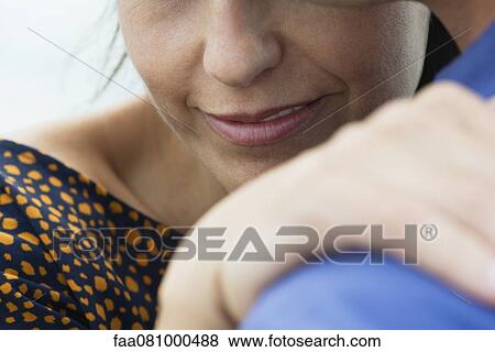 Stock Photo - Couple hugging, cropped. Fotosearch