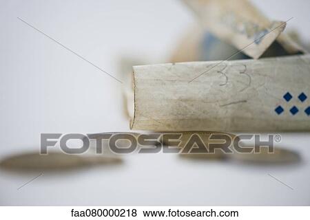 Stock Photo - Crumpled banknote and coins. Fotosearch