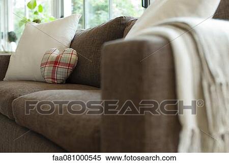 Stock Photography - Cushions on sofa in living room. Fotosearch