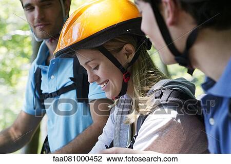 Cyclists hanging out together, focus on woman View Large Photo Image Stock Image - Cyclists hanging out together, focus on woman. Fotosearch