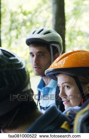 Cyclists hanging out together, focus on woman View Large Photo Image Stock Image - Cyclists hanging out together, focus on woman. Fotosearch