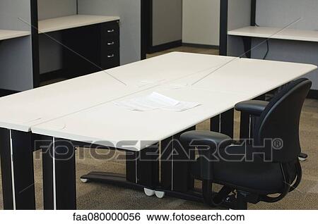 Documents on desk in empty office View Large Photo Image Stock Photograph - Documents on desk in empty office. Fotosearch