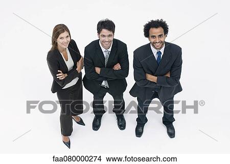 Picture - Executives standing together with arms folded, portrait. Fotosearch