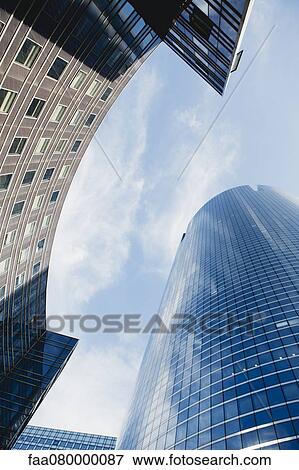 Facade of modern office buildings, low angle view View Large Photo Image Stock Photo - Facade of modern office buildings, low angle view. Fotosearch
