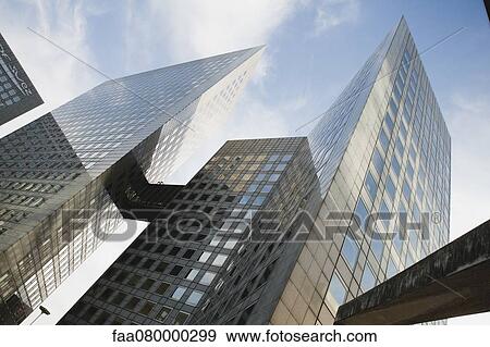 Stock Photo - Facade of skyscrapers, low angle view. Fotosearch