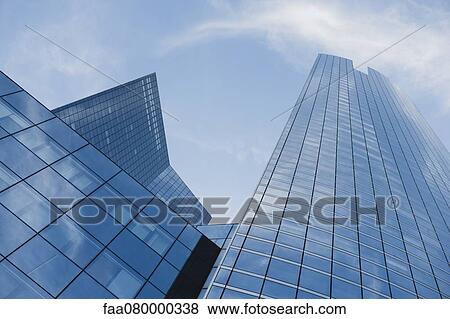 Facade of skyscrapers, low angle view View Large Photo Image Stock Photo - Facade of skyscrapers, low angle view. Fotosearch