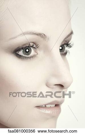 Stock Photograph - Face of young woman, portrait. Fotosearch