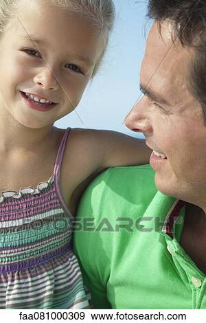 Stock Photo - Father and daughter, portrait. Fotosearch