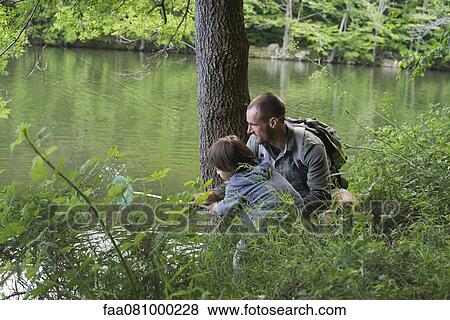 Father and son fishing View Large Photo Image Stock Photo - Father and son fishing. Fotosearch